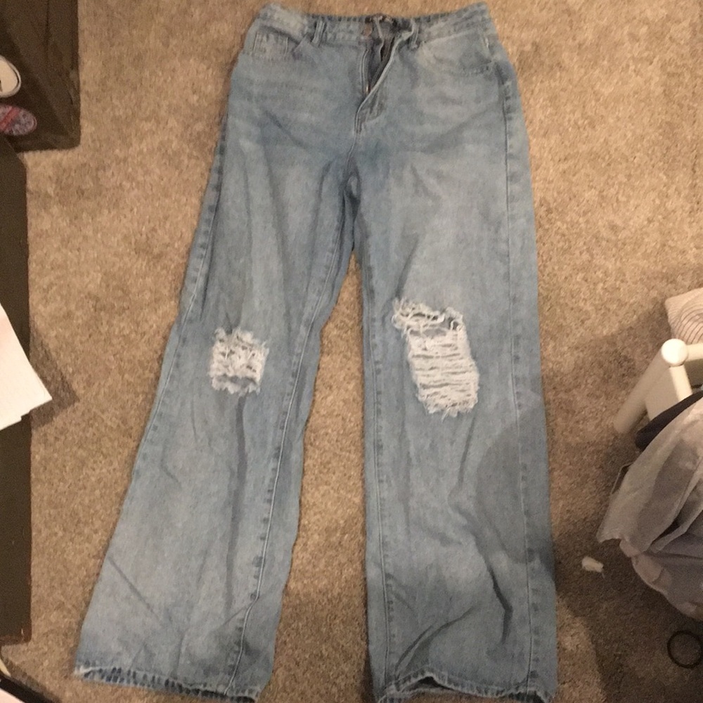 blue jeans with holes in the knees